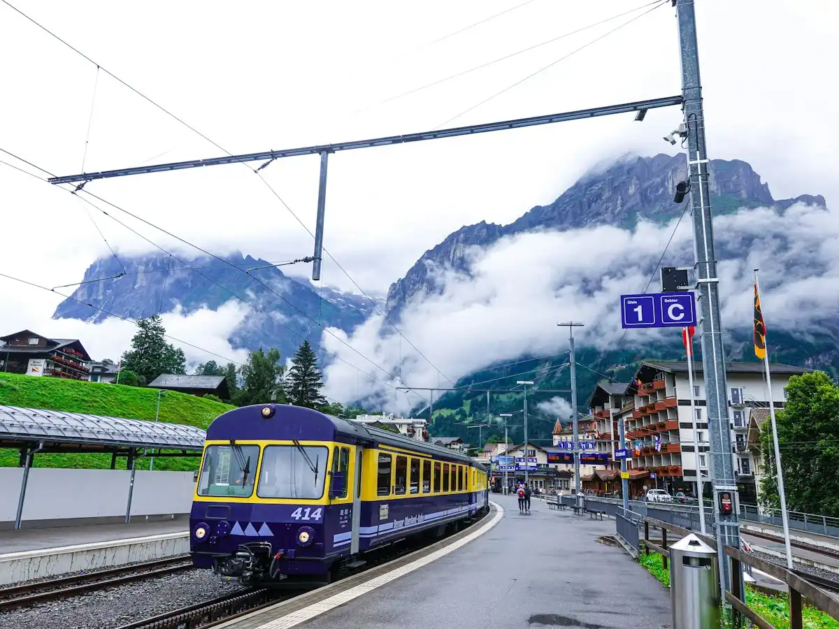 Blue and yellow train — Grindelwald station, Switzerland