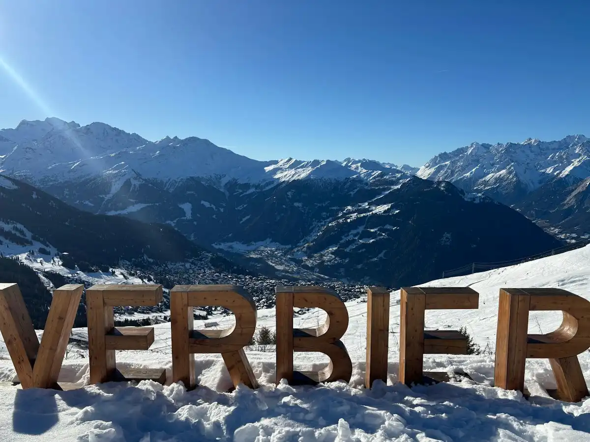 Large wooden letters spell verbier with snowy mountains behind — Verbier, Switzerland